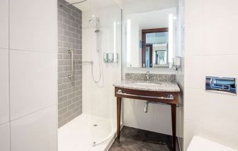 Guest bathroom with shower at Hampton By Hilton Humberside Airport.