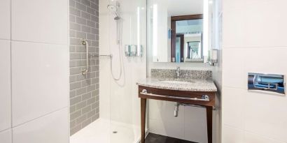 Guest bathroom with shower at Hampton By Hilton Humberside Airport.