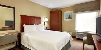 King bed with business desk at Hampton Inn Ft. Lauderdale-Cypress Creek.