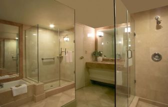 Guest bathroom with shower at Hilton Los Angeles Airport.