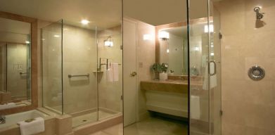 Guest bathroom with shower at Hilton Los Angeles Airport.