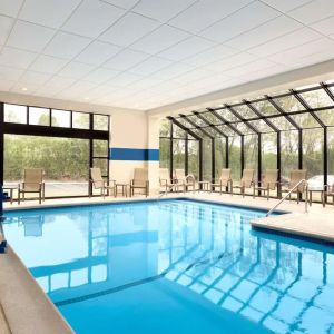 Lovely indoor pool with seating area at DoubleTree By Hilton Hartford - Bradley Airport.