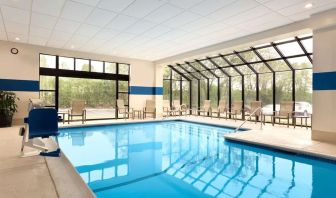 Lovely indoor pool with seating area at DoubleTree By Hilton Hartford - Bradley Airport.