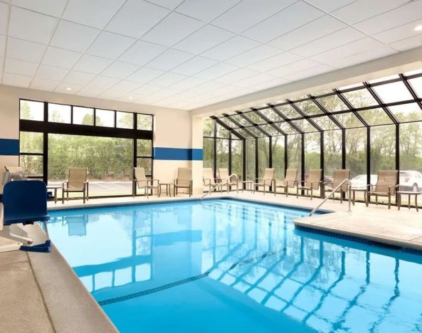 Lovely indoor pool with seating area at DoubleTree By Hilton Hartford - Bradley Airport.