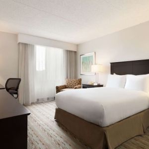 King bed room with TV and work desk at DoubleTree By Hilton Hartford - Bradley Airport.