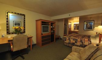 Day use room with work desk and sofa at Shilo Inn Rose Garden.
