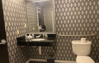 Guest bathroom with shower at Park Manor Hotel.