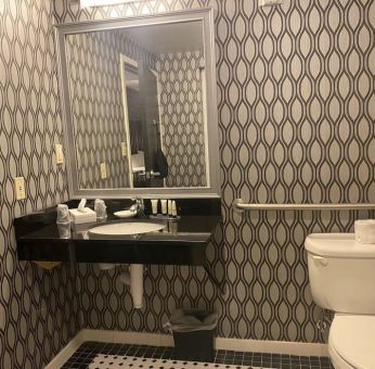 Guest bathroom with shower at Park Manor Hotel.