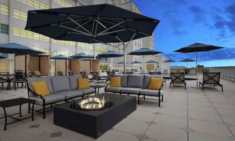 Relaxing outdoor terrace with fire pits at Hilton Baton Rouge Capitol Center.