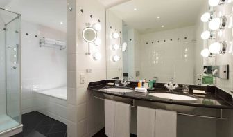 Guest bathroom with shower at Hilton Berlin.