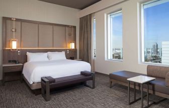 Delux king with natural light at H Hotel Los Angeles, Curio Collection By Hilton.