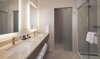 Guest bathroom with shower at H Hotel Los Angeles, Curio Collection By Hilton.