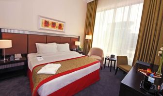 Delux king room with natural light at Millennium Central Doha.