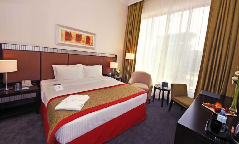 Delux king room with natural light at Millennium Central Doha.