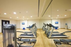 Equipped fitness center at Millennium Central Doha.