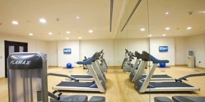 Equipped fitness center at Millennium Central Doha.