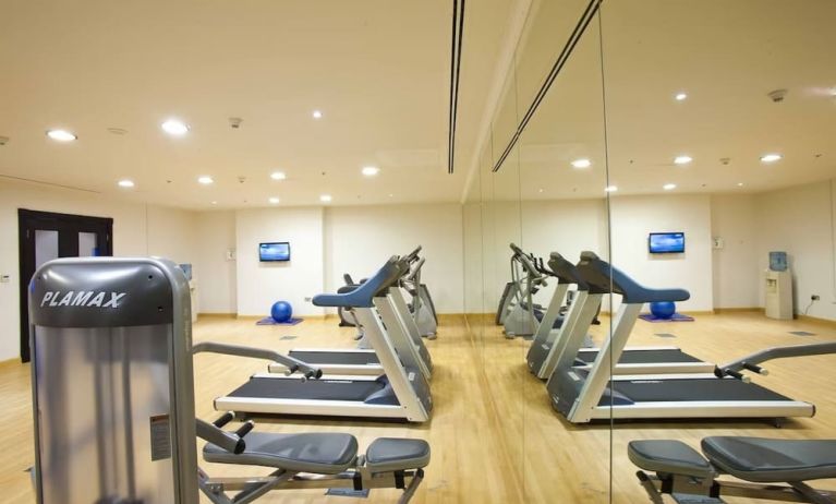 Equipped fitness center at Millennium Central Doha.