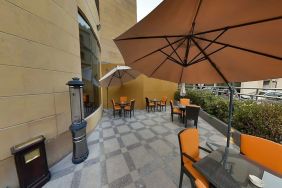 Outdoor terrace and coworking space at Millennium Central Doha.