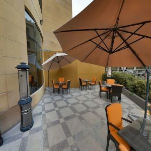 Outdoor terrace and coworking space at Millennium Central Doha.