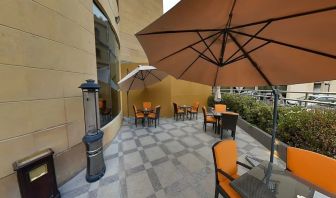 Outdoor terrace and coworking space at Millennium Central Doha.