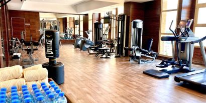 Equipped fitness center at Millennium Hotel Doha.