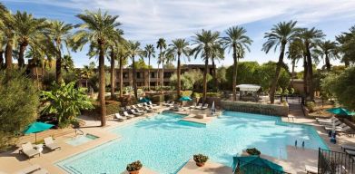 Relaxing outdoor pool with pool chairs at DoubleTree Resort By Hilton Paradise Valley - Scottsdale.