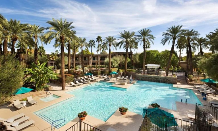 Relaxing outdoor pool with pool chairs at DoubleTree Resort By Hilton Paradise Valley - Scottsdale.