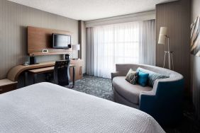 Delux king bed with TV at Sonesta Emeryville - San Francisco Bay Bridge.