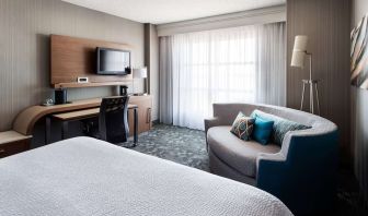 Delux king bed with TV at Sonesta Emeryville - San Francisco Bay Bridge.