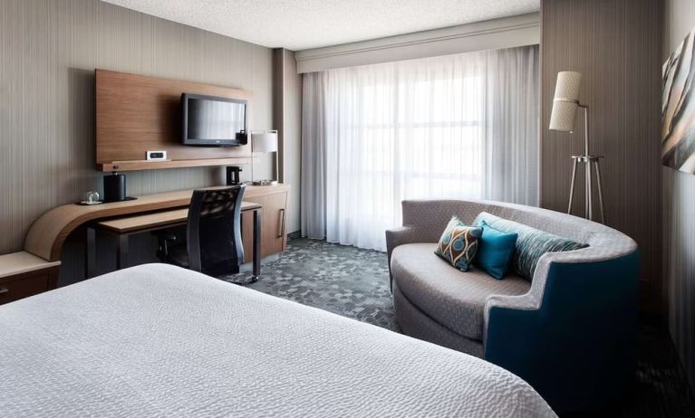 Delux king bed with TV at Sonesta Emeryville - San Francisco Bay Bridge.