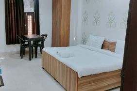 Comfortable king room with natural light at Hotel Urban Abode.