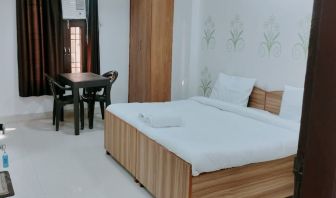 Comfortable king room with natural light at Hotel Urban Abode.