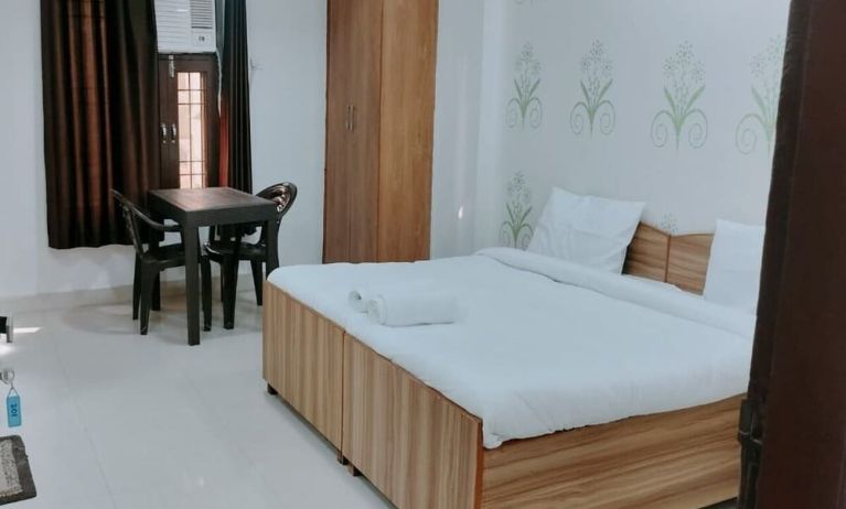 Comfortable king room with natural light at Hotel Urban Abode.