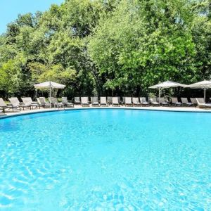 Luxurious outdoor pool with pool chairs at Hilton Short Hills.