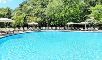 Luxurious outdoor pool with pool chairs at Hilton Short Hills.