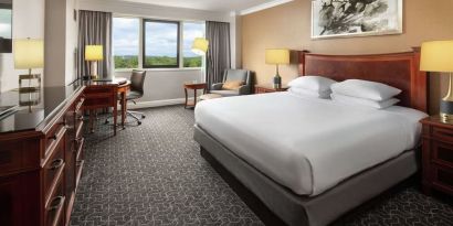 Spacious king room with TV and work station at Hilton Short Hills.