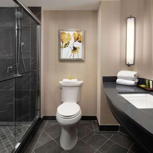 Guest bathroom with shower at Hilton Short Hills.