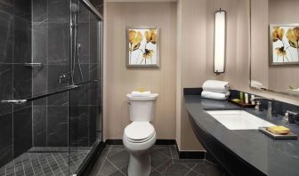 Guest bathroom with shower at Hilton Short Hills.