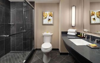 Guest bathroom with shower at Hilton Short Hills.