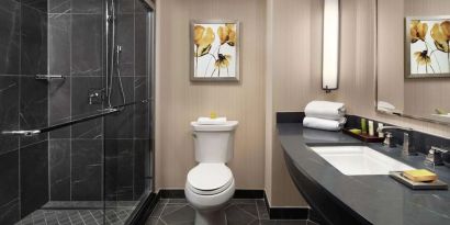 Guest bathroom with shower at Hilton Short Hills.