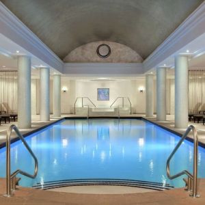 Stunning indoor pool with pool chairs at Hilton Short Hills.