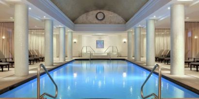 Stunning indoor pool with pool chairs at Hilton Short Hills.