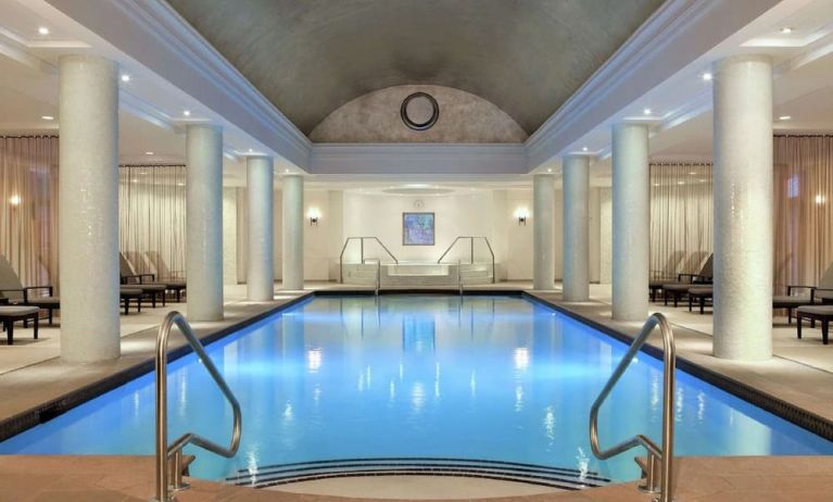 Stunning indoor pool with pool chairs at Hilton Short Hills.