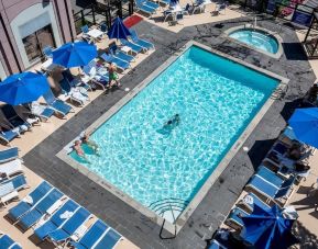 Relaxing pool area with pool chairs at Hilton Whistler Resort & Spa.