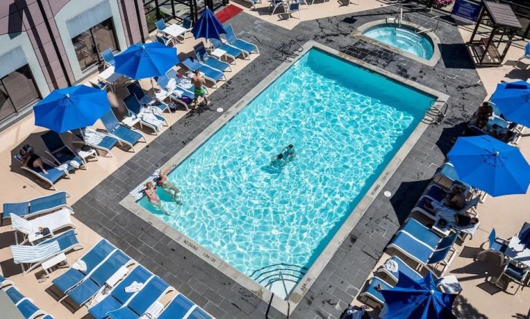 Relaxing pool area with pool chairs at Hilton Whistler Resort & Spa.