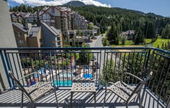 Day rooms with balcony and seating area at Hilton Whistler Resort & Spa.