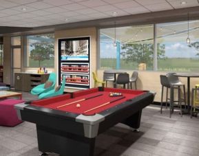 Coworking space and game room at Tru By Hilton Toronto Airport West.