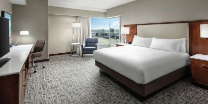 Delux king room with natural light at Hilton Boston Logan Airport.