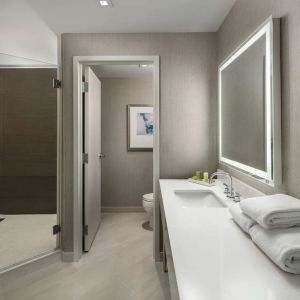 Guest bathroom with shower at Hilton Boston Logan Airport.