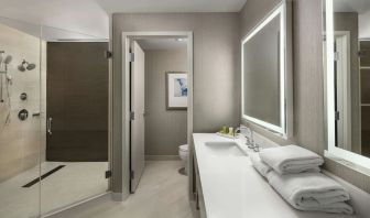 Guest bathroom with shower at Hilton Boston Logan Airport.